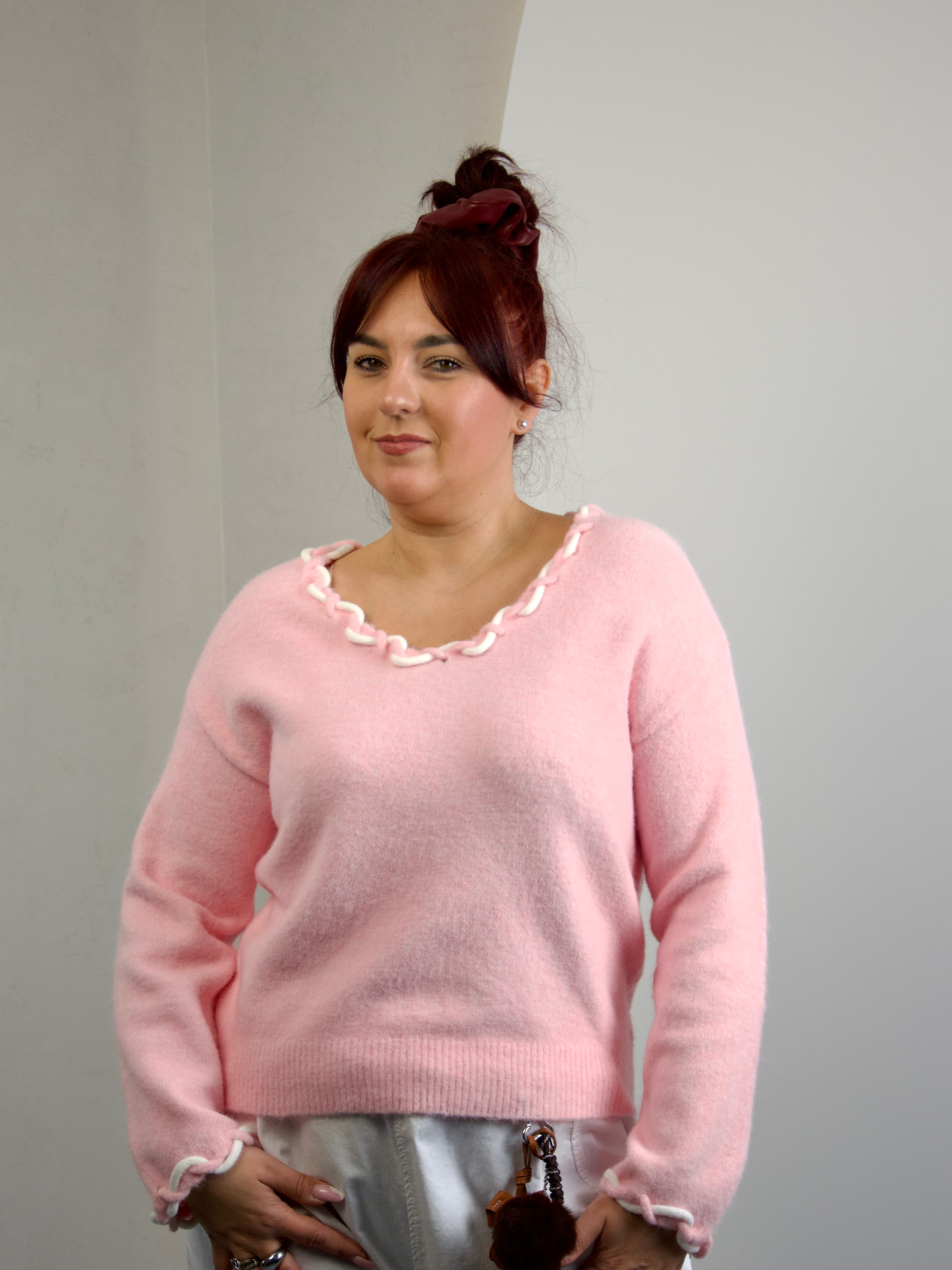 Sweater with decorative knit detailing at the neckline